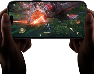 Two hands holding iPhone 18 Pro, in landscape mode, playing Monster Hunter Outlanders video game, demonstrating the performance capabilities of the A20 Pro Chip