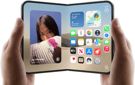 iPhone Duo, Star White color, held by two hands in landscape orientation, unfolded, interior screen displays photos on the left, apps on the right