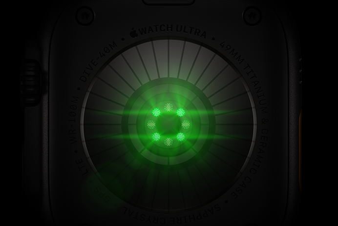 Back of Apple Watch Ultra 4, titanium case, black color, multiple round sensors with glowing green LED lights